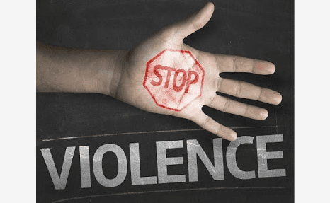 A hand with the word violence written on it.